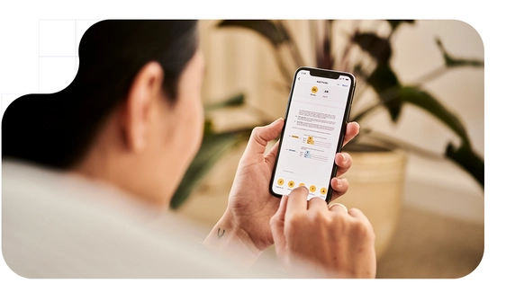 Man with an electronic device in his hand signing electronically.