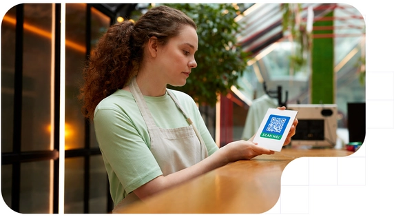 Girl showing a QR code to be scanned