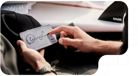 Man performing a handwritten signature using his iphone